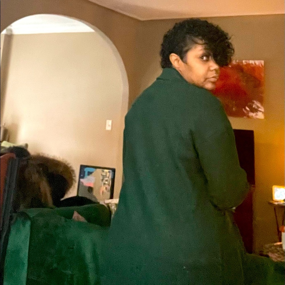 Green Top Shop Coat below the knee.